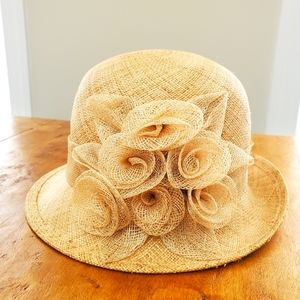 Natural Straw cloche hat with straw flower embellishment in the back